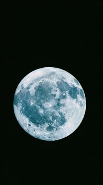 Static pan tracking shot of full moon drifting and rotating across black night sky presented in three panel triptych sequence