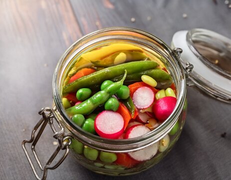 freshly pickled vegetables in a jar colorful mix of cucumber pepper radish and edamame