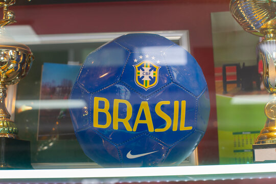 February 27, 2021. Belarus. Minsk. Shop window. A soccer ball is displayed in a store with the colors and symbols of the Brazil team. The scene captures the spirit of soccer culture.