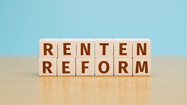 "Rentenreform" (pension reform) built with toy cubes. A pension reform is in discussion in Germany. Camera tilt and move
