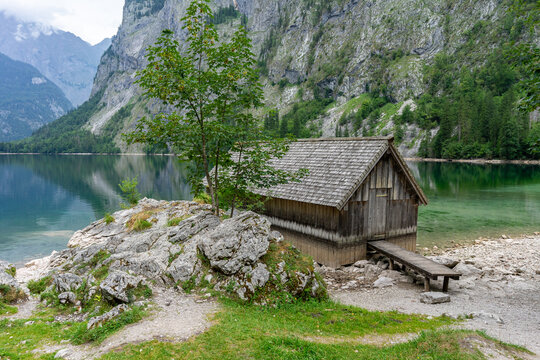 Beautiful Mountain Lake Shore with 
Fisherman's hut in the Berchtesgaden Alps, Bavaria, Germany &ndash; Scenic Travel and Tourism Concept