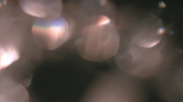 Abstract blurred light bokeh background with dark atmosphere.