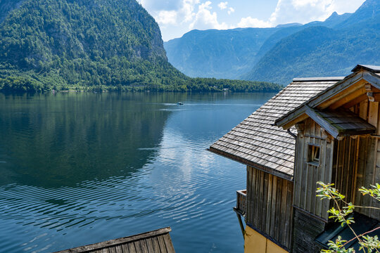 Hallstatt old traditional Wooden House with Wooden Balcony in Alpine Village rural landscape. Hallstatt, Austria lake water nature