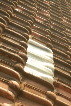 Stack of terracotta roof tiles texture background for building material