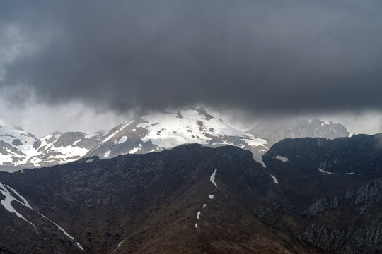 Dramatic storm clouds over Ligurian Alps mountain range, Italy
