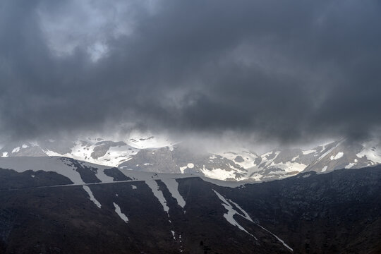 Dramatic storm clouds over Ligurian Alps mountain range, Italy