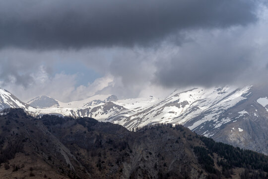 Dramatic storm clouds over Ligurian Alps mountain range, Italy