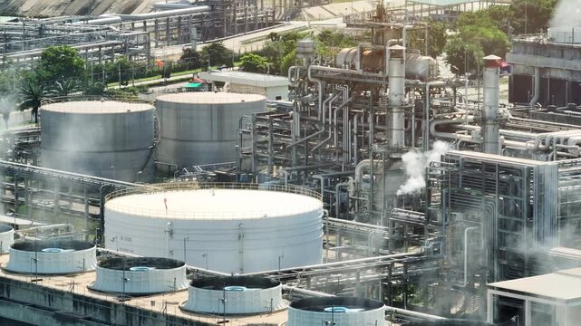 Aerial view of cooling tower vapor emissions within an eco-industrial park, showcasing industrial water stewardship, circular water use, thermal management, and green infrastructure integration. 4k.
