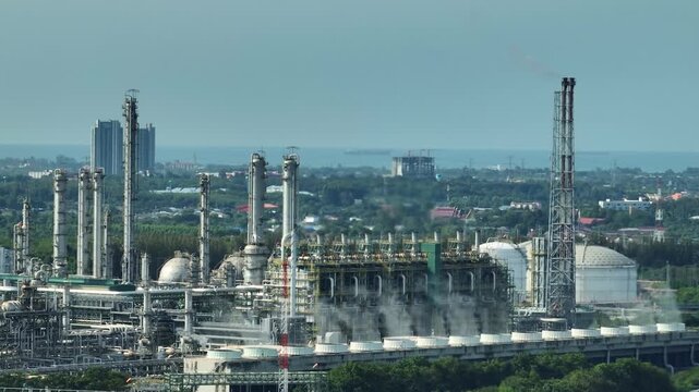 Aerial view of cooling tower vapor emissions within an eco-industrial park, showcasing industrial water stewardship, circular water use, thermal management, and green infrastructure integration. 4k.
