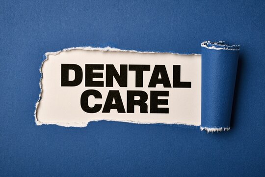 Black text dental care written under torn blue paper