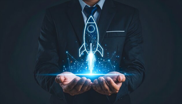 Business professional holding glowing holographic rocket icon representing startup launch success and growth.