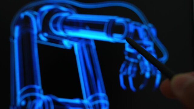 A robotics engineer uses a stylus to inspect a digital robotic arm blueprint on a futuristic display, symbolizing industrial automation, robotic engineering, smart manufacturing,  precision control.
