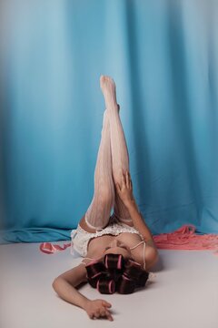 Captivating elegance unfolds in a creative indoor space with whimsical pastel colors and charming poses