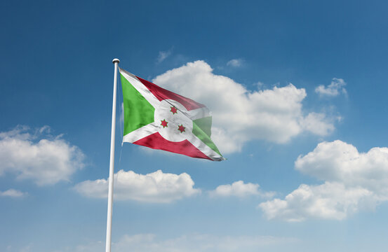 Burundi flag waving in beautiful sky.