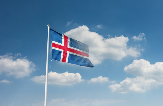 Iceland flag waving in beautiful sky.