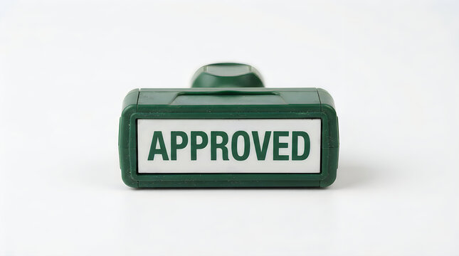 Green rubber office stamp with approved text for document verification and authorization, approved