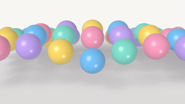 Colorful glossy balls bouncing wave motion seamless loop 4K playful background