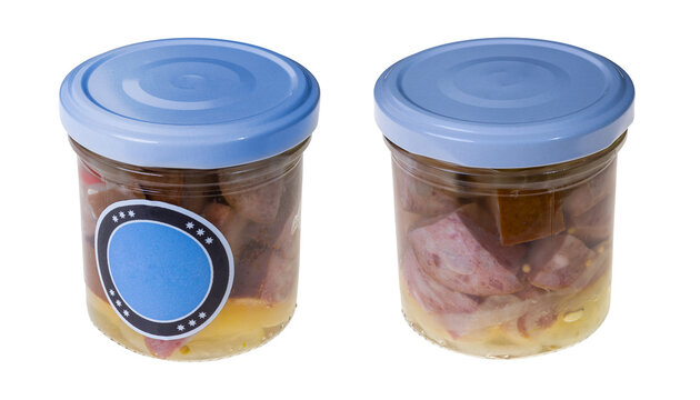 Pickled diced sausage with onion in glass jars isolated on white background. Preserved meat product of mix pork, beef and smoked bacon in spicy sweet and sour marinade. Traditional Czech cuisine food.