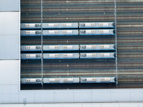 Multiple metro trains parked on parallel railway tracks at Long Binh Depot in Ho Chi Minh City, Vietnam, showcasing modern urban rail transportation i