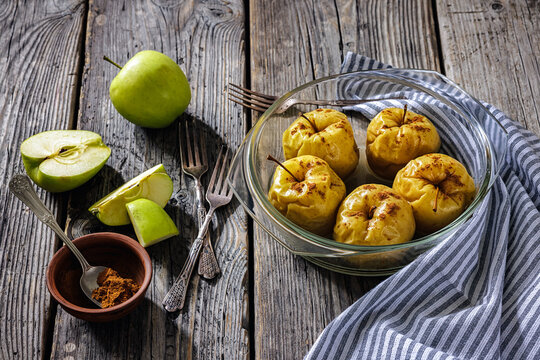 Whole Baked green apples in a glass baking dish