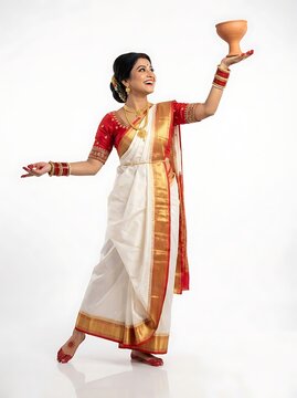 Beautiful indian woman in traditional saree holding a clay pot isolated on white background