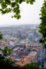 Fototapeta premium Between Trees View of Donostia-San Sebastián City, Gipuzkoa, Basque Country (Spain)