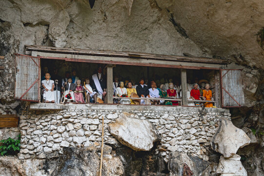 Traditional Tau Tau wooden effigies overlooking the ancient burial site at Londa, North Toraja, Indonesia