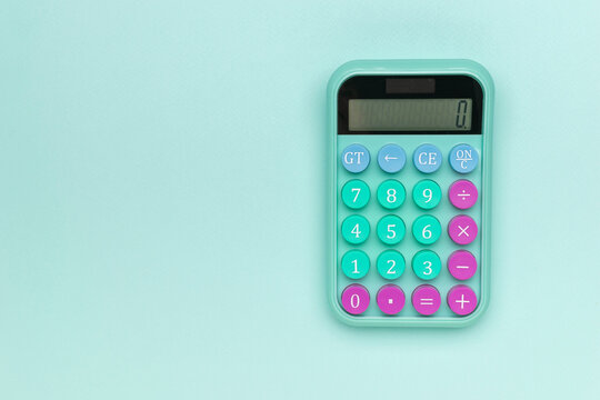 Pastel Calculator on Minimalist Mint Green Background for Office and Education Concepts