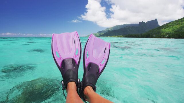 Travel vacation beach concept Snorkel feet snorkeler having fun with pink snorkel fins. Legs closeup of swimmer relaxing on sea background, Raw unedited video of real persons feet.