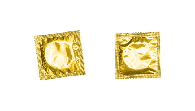 Gold foil wrapped condom isolated PNG on transparent background, contraceptive protection for safe sex and sexual health