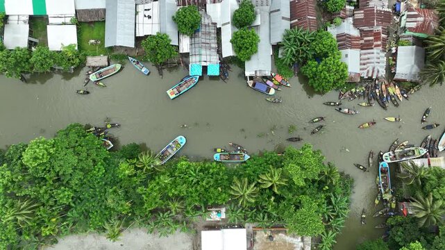 Aerial view of traditional floating market on river in asian village