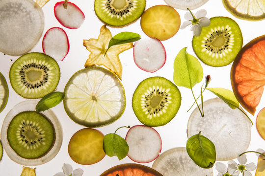 Citrus fruit, kiwi, variety fruits  segments on a white background, top view