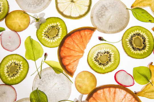 Citrus fruit, kiwi, variety fruits  segments on a white background, top view