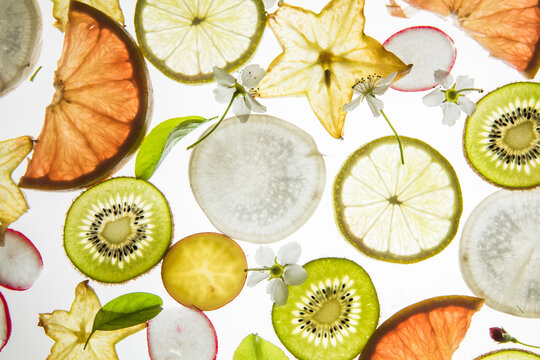 Citrus fruit, kiwi, variety fruits  segments on a white background, top view