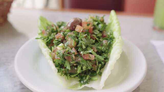 Delicious and healthy lebanese tabbouleh salad with fresh parsley, tomato, and bulgur