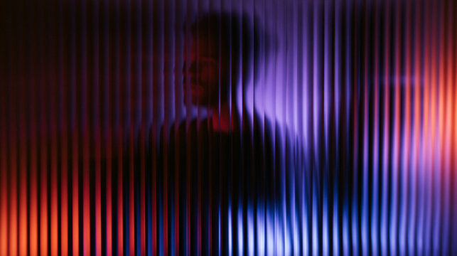 Silhouette of Man Behind Fluted Glass in Neon Light