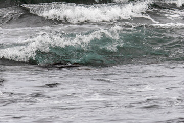 Ocean waves breaking over volcanic rocks on the coast of the Big Island Hawaii © Joao Vieira