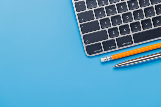 Office supplies on blue desk