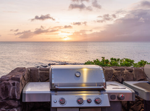 Grill on the beach at sunset