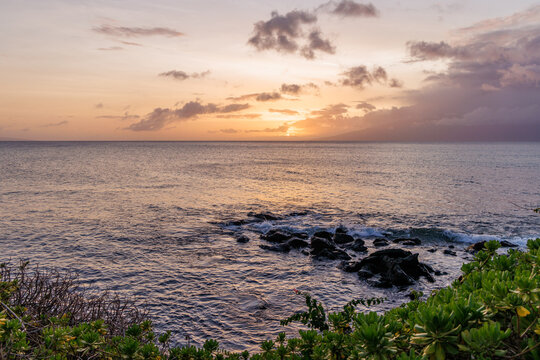 Calm ocean at sunset in Hawaii
