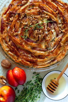 Pie with nectarines and camembert.