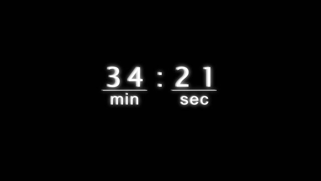 Digital clock display counting thirty four minutes and twenty one seconds on black base.