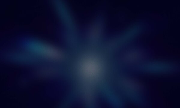 Abstract background with a bright central light burst and soft glowing blue rays on dark space