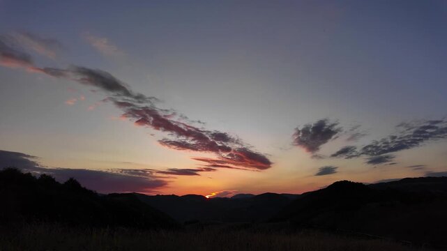 Silhouettes of hills and mountains in blue hour time.