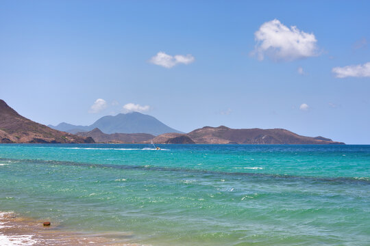 Scenic View of Turquoise Sea with Jet Ski and Nevis Peak in St. Kitts