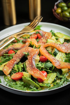 Salad with salted salmon and arugula