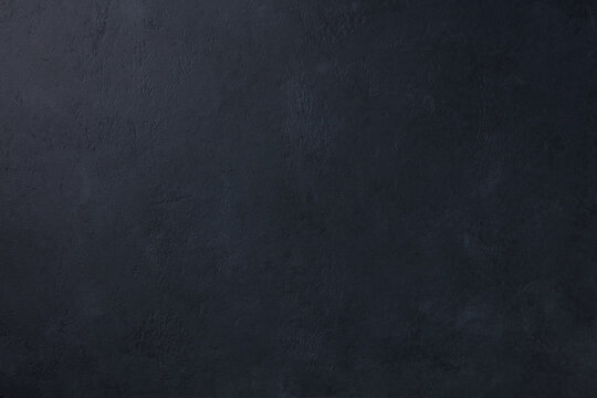 Dark black slate stone concrete texture background pattern with high resolution. Top view. Copy space.
