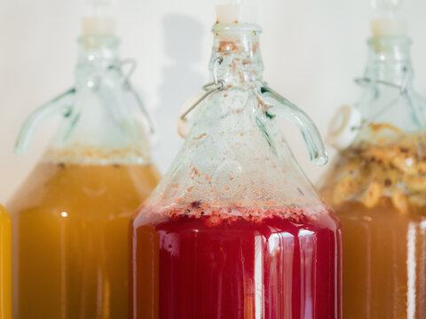 Homemade drinks fermenting in kitchen