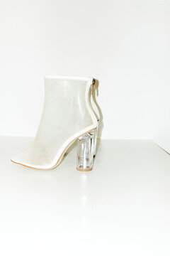 Shiny fashion style high heels shoes with hard direct flashlight