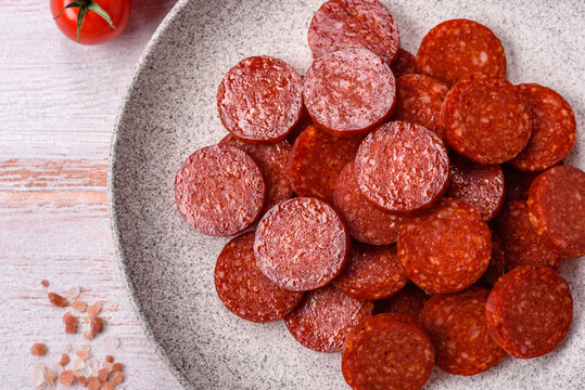 Slices of smoked pepperoni or salami for making homemade pizza. Sliced pepperoni